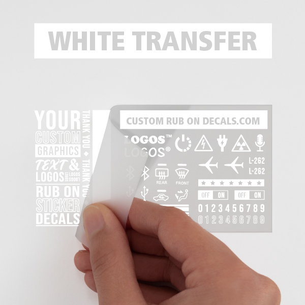 A person is holding up White Custom Dry Rub On Transfer Lettering Decals.
