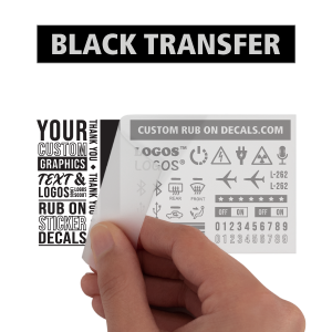 A hand holding a Black Custom Dry Rub on Decal Transfer with a Deep Rich Satin Finish.