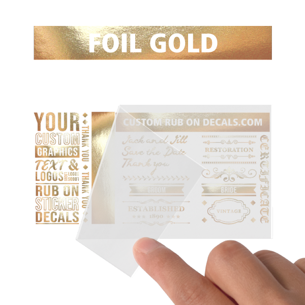 A person is displaying a Foil Gold Custom Dry Rub on Transfer.