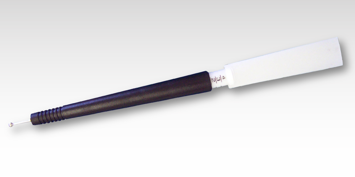 A black and white pen with a white tip for dry transfers.