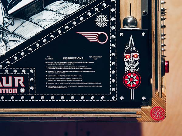 A custom-designed pinball machine featuring a skull and crossbones obtained through the application of dry transfers. A custom-designed pinball machine featuring a skull and crossbones obtained through the application of dry transfers.