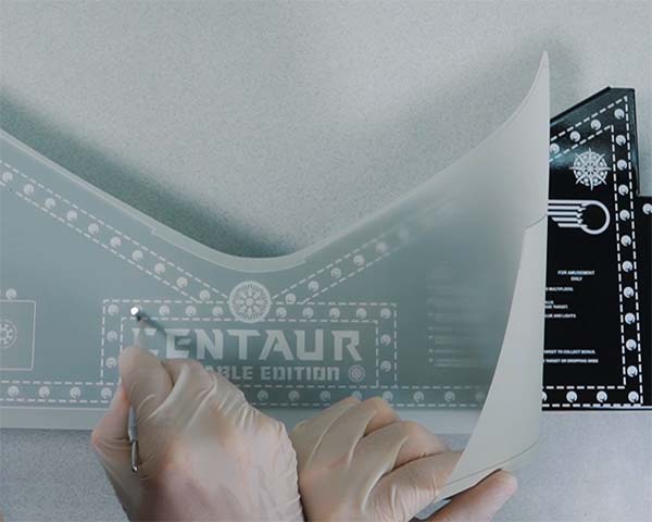 A person holding a custom rub on transfer. A person holding a custom rub on transfer.