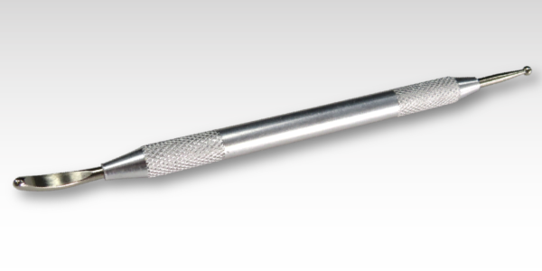 A silver rub down transfer on a gray background.