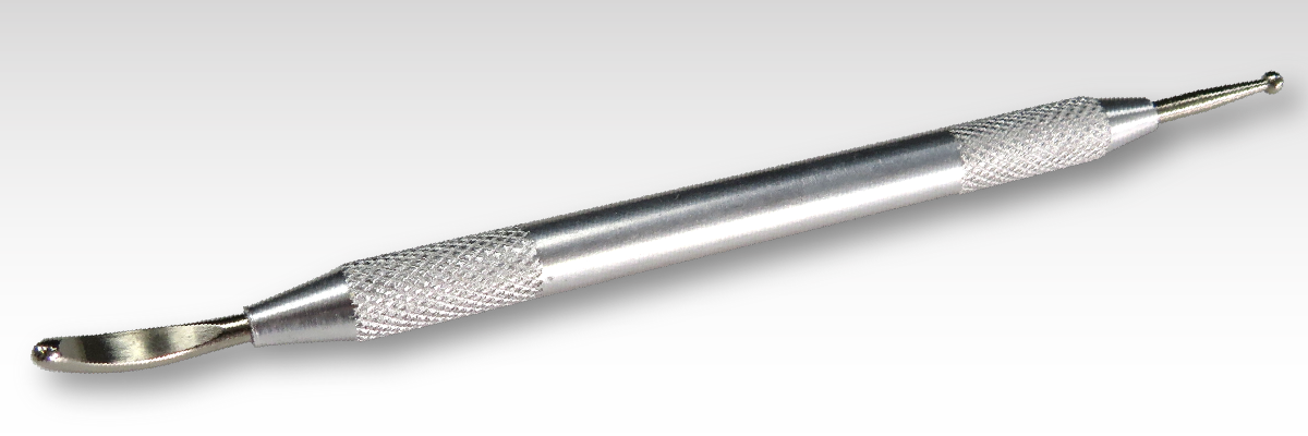 A custom rub on transfer tool featuring a metal handle against a gray background. A custom rub on transfer tool featuring a metal handle against a gray background.