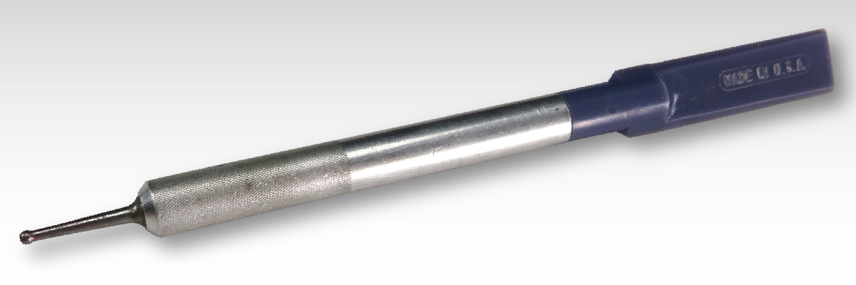 A custom rub on transfer of a blue and silver drill bit on a grey background. A custom rub on transfer of a blue and silver drill bit on a grey background.